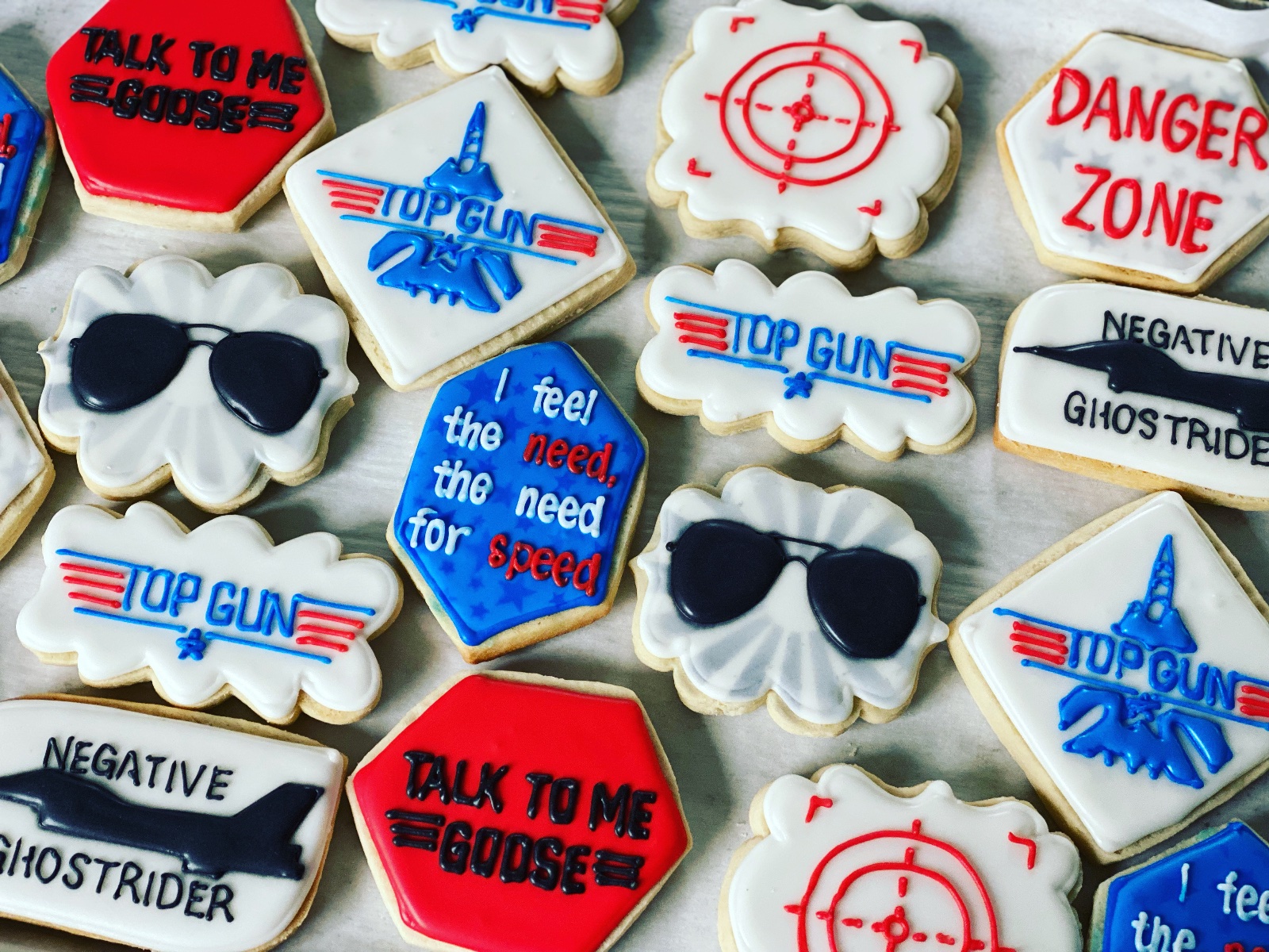 Custom decorated cookies by Kicker Konfections