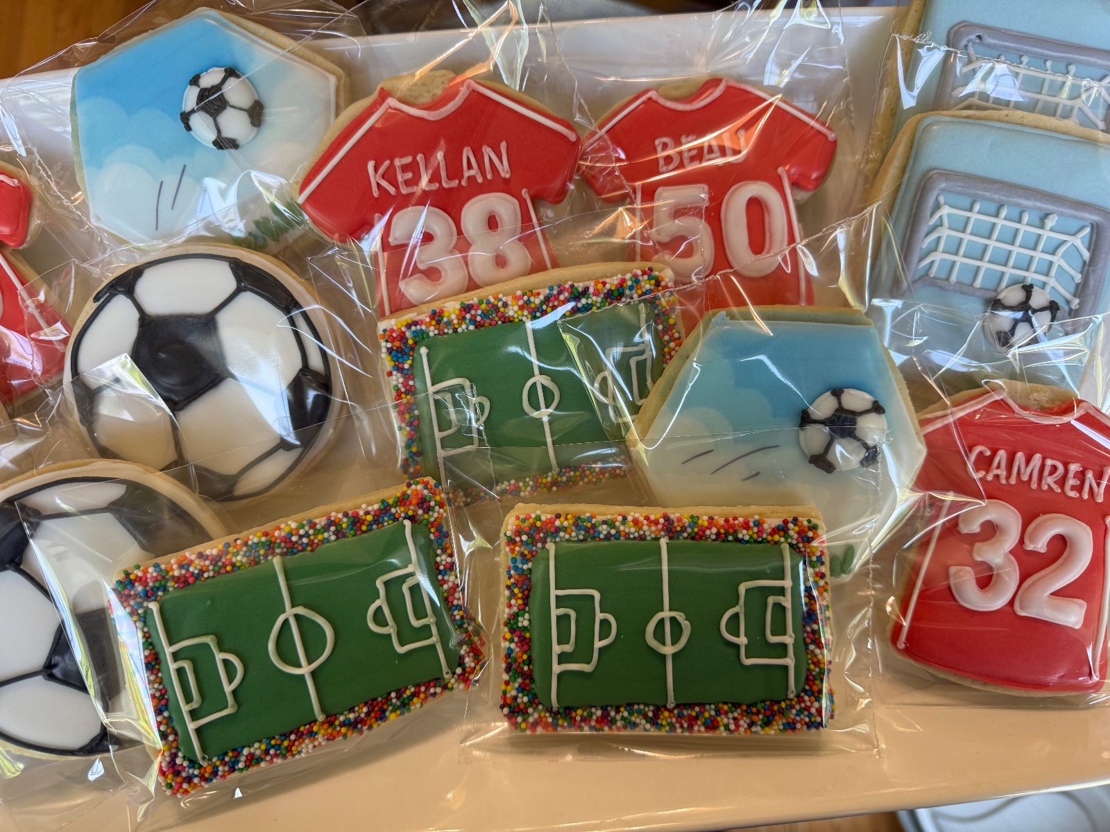 Custom decorated cookies by Kicker Konfections