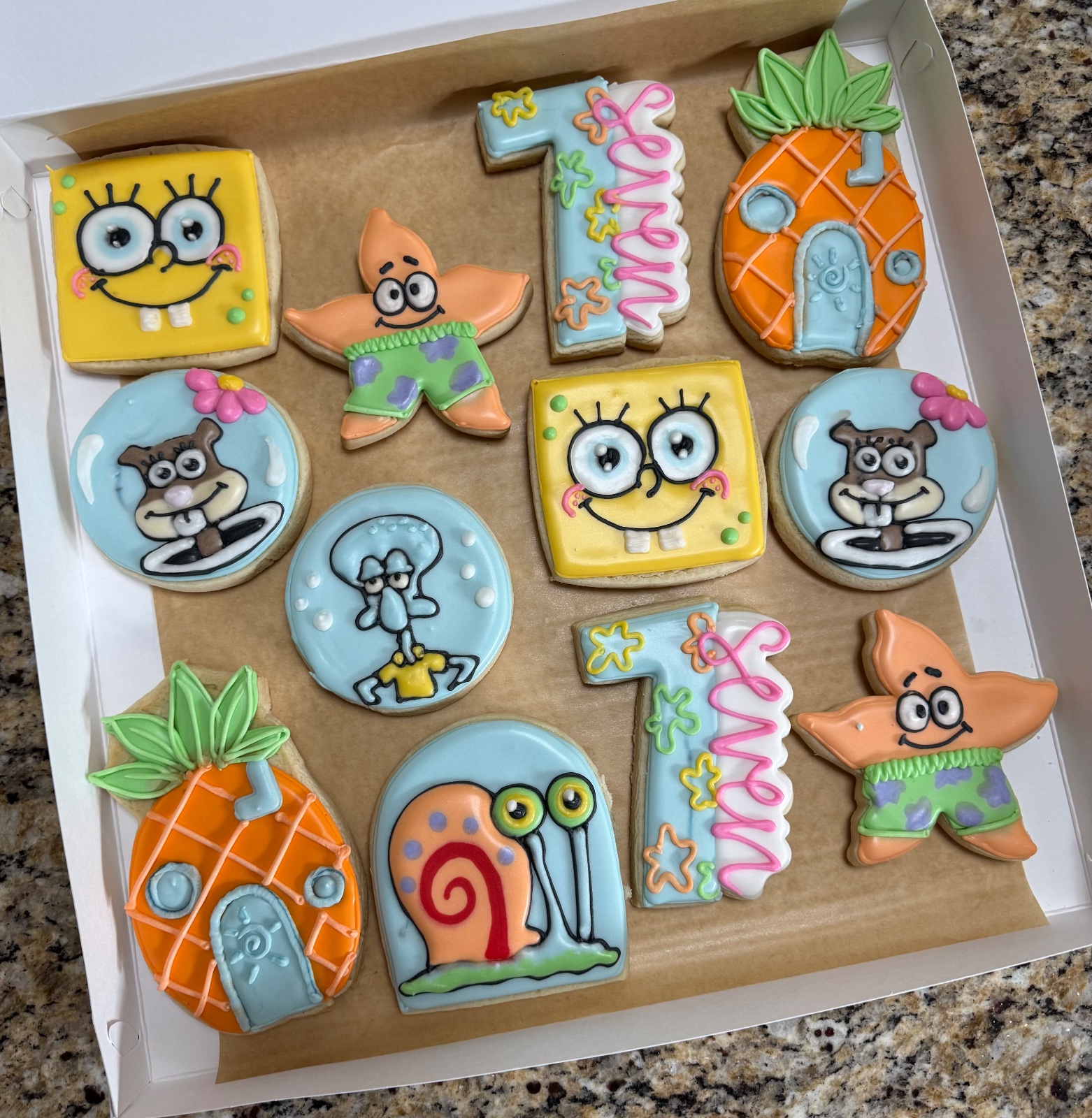 Custom decorated cookies by Kicker Konfections